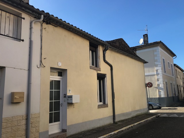 A stone built town house for sale in the heart of a bastide market town.